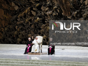 Pope Francis (C) is leading his weekly general audience in Paul VI Hall, Vatican City, on January 3, 2024. (