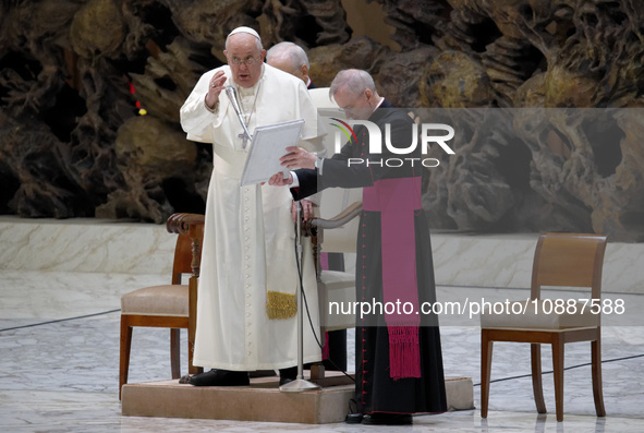 Pope Francis is arriving for his weekly general audience in the Pope Paul VI hall at the Vatican, on January 3, 2024. 