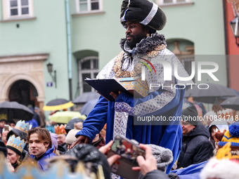 An actor who plays one of the Wise Man, perform Nativity Play on the street of Old Town of Krakow, Poland on January 6, 2024. January 6 is P...