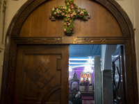 An Iranian-Armenian clergyman is preparing to observe a Christmas mass prayer ceremony at the St. Vartan Armenian Church in central Tehran,...