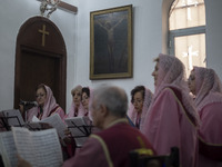 Iranian-Armenian clergywomen are performing at the St. Vartan Armenian Church in central Tehran during a Christmas mass prayer ceremony on J...