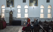 An Iranian-Armenian family is praying at the St. Vartan Armenian Church in central Tehran...