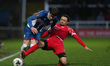 Tom Crawford of Hartlepool United is battling with Nya Kirby of Oxford City during the Van...