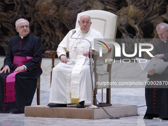 Pope Francis (C) is sitting between Italian priest Monsignor Leonardo Sapienza (C-L) and Argentinian priest Monsignor Luis Maria Rodrigo Ewa...