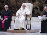 Pope Francis (C) is sitting between Italian priest Monsignor Leonardo Sapienza (C-L) and Argentinian priest Monsignor Luis Maria Rodrigo Ewa...