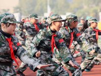 Children are demonstrating military boxing during a national defense education class at Bengbu Road No. 3 Primary School in Hefei, East Chin...