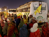 Hindu pilgrims are getting ready to travel from a transit camp on their way to Ganganagar, a Hindu pilgrimage site that devotees visit for a...