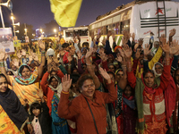 Hindu pilgrims are getting ready to travel from a transit camp on their way to Ganganagar, a Hindu pilgrimage site that devotees visit for a...