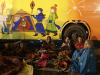 Hindu pilgrims from India are spending the night under the sky at a transit camp while on their way to Ganganagar, a Hindu pilgrimage site t...
