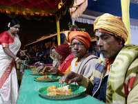 Indian transgender individuals are distributing free food to Hindu pilgrims at a camp organized by a social organization run by the transgen...