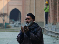 A man is praying at the Jamia Masjid, or Grand Mosque, in Srinagar, Kashmir, India, on January 12, 2024. Special congregational prayers know...