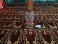 A man is offering prayers at the Jamia Masjid, or Grand Mosque, in Srinagar, Kashmir, India, on January 12, 2024. Special congregational pra...