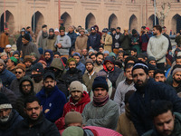 Kashmiris are listening to a sermon by the priest before offering special prayers in the compound of Jamia Masjid in Srinagar, Kashmir, Indi...