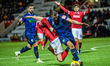Ollie Clarke of Mansfield Town and Joel Senior of Morecambe are tangling during the Sky Be...