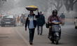 Commuters Are Seen On The Fog Engulfed Road In A Winter Morning In The Eastern Indian Stat...