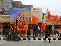Saffron flags of Lord Ram and Sita are being displayed in a roadside flag shop ahead of the Ram temple opening in Ayodhya, Uttar Pradesh, In...