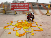 A man is decorating with flowers near the Ram temple ahead of its opening in Ayodhya, Uttar Pradesh, India, on January 20, 2024. (