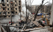 A section of an apartment building is lying in ruins following a Russian missile attack in...