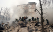 Rescuers are searching for people under the rubble at a residential building damaged in th...