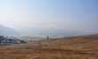 A general view shows the dry meadows, which are typically covered in a thick blanket of sn...