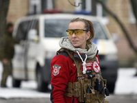 In Kyiv, Ukraine, on January 23, 2024, a volunteer from a rapid response unit of the Ukrainian Red Cross Society is providing help to people...