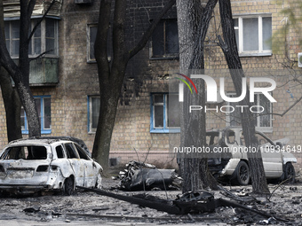 Two cars are catching fire as a result of falling Russian missile debris in the Sviatoshynskyi district after the Russian missile attack on...