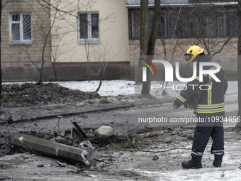 A rescuer is pointing to the ground in the Sviatoshynskyi district after the Russian missile attack on Tuesday morning, in Kyiv, Ukraine, on...