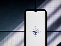 The NATO logo is displayed on a smartphone screen in Athens, Greece, on January 24, 2024. (