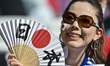 A Japan national team fan is sitting inside Al Thumama Stadium in Doha, Qatar, on January...