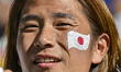 A Japan national team fan is sitting inside Al Thumama Stadium in Doha, Qatar, on January...