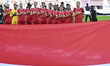 The Indonesia team players are standing for the national anthem ahead of the AFC Asian Cup...