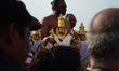 Indian priests from Andhra Pradesh perform a ritual as they worship Golden idol of hindu L...