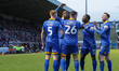 Captain Chey Dunkley is celebrating after scoring for Shrewsbury Town, extending their lea...