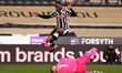 Aaron Nemane of Notts County is jumping over Paul Farman of Barrow during the Sky Bet Leag...