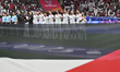 The Palestine team players are standing for the national anthem ahead of the AFC Asian Cup...