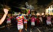 People are following the carnival group called 'The Elephant of Olinda' during a pre-carni...