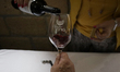 People are tasting wine during the press conference announcing the 3rd Cuautitlan Izcalli...