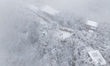 Tourists are viewing rime at Zijin Mountain after a snowfall in Nanjing, Jiangsu Province,...