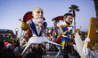 A float featuring political satire representations of Vladimir Putin and Volodymyr Zelensk...
