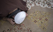 An Iranian cleric is praying after a mass prayer ceremony at the A'zam Mosque in Qom, Iran...