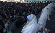 Veiled Iranian schoolgirls are participating in a ceremony at the holy mosque of Jamkaran...