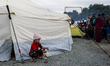 A child plays at the makeshift camp at the Greek-Macedonian borders, near the village of I...