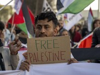 A person is holding a banner with the inscription ''Free Palestine'' during a demonstration in central Lisbon, Portugal, on February 10, 202...