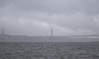 A general view of the ''25 April'' bridge is seen during atmospheric depression ''Karlotta...