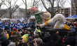 A carnival float featuring Russian President Vladimir Putin kneeling down with a Russian O...