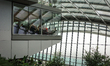 People are looking at a cloudy London from the Sky Garden at the top of a skyscraper on Fe...