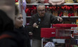 An Iranian trader is preparing a Valentine's Day gift for his customer at his shop in down...