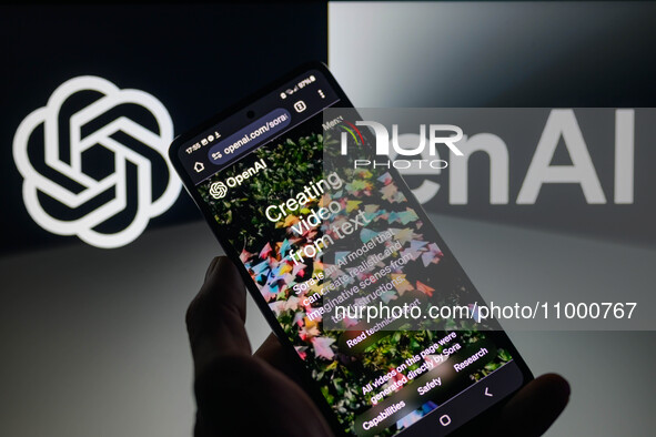 The OpenAI webpage is being displayed on a smartphone with the OpenAI logo visible in the background in this photo illustration, taken in Br...