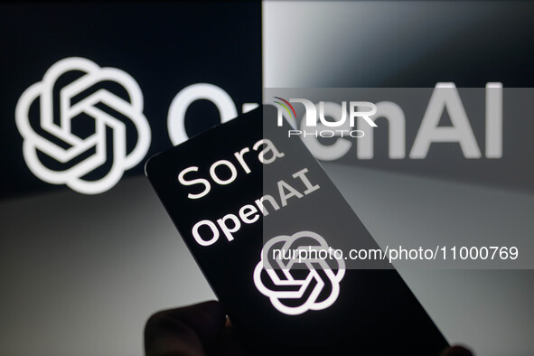 The OpenAI - Sora logo is being displayed on a smartphone with OpenAI visible in the background in this photo illustration, taken in Brussel...