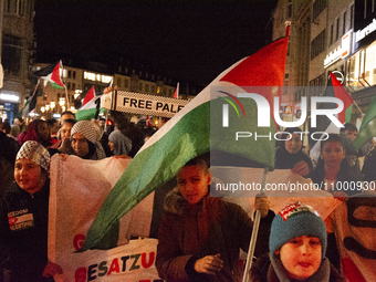 More than a hundred pro-Palestinian protesters are gathering at Muenster Square in the city center of Bonn, Germany, on February 16, 2024, d...